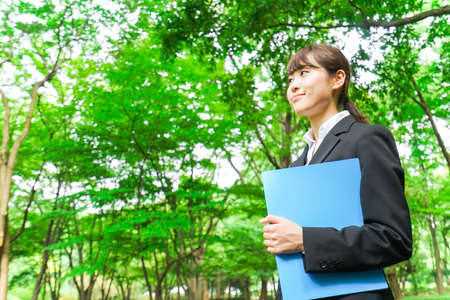 Young business woman holding documentsの写真素材