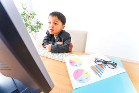 Child businessman working at officeの写真素材