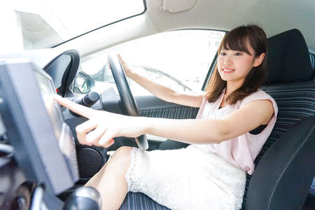 Woman using car navigationの写真素材