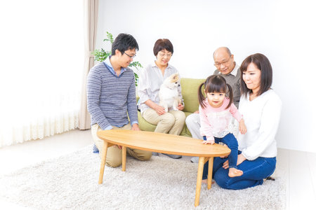 Happy family with dogの写真素材