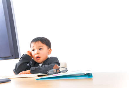 Child businessman working at officeの写真素材
