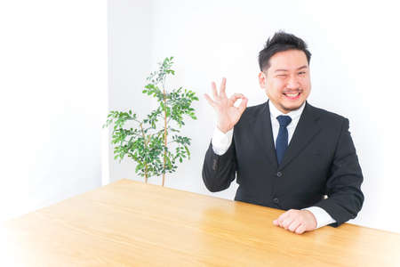 Businessman giving ok signの写真素材