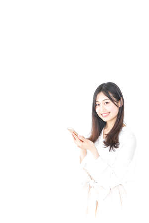 Young woman using smartphoneの写真素材