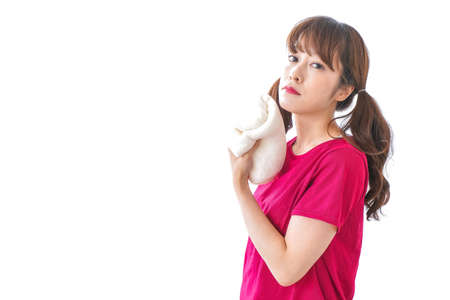 Woman wiping sweat imageの写真素材