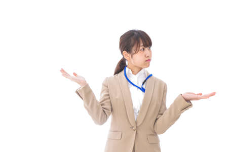 Businesswoman making a comparison with somethingの写真素材