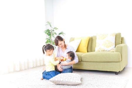 Happy family having a babyの写真素材