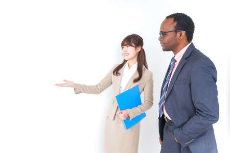 Businesswoman guiding visiterの写真素材