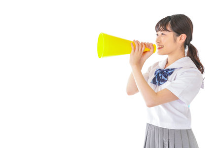 A high school girl holding a megaphone shot in the studio