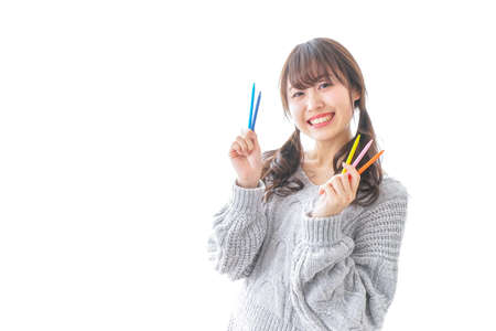 Woman having  multicolored pencilの写真素材