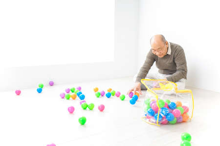 Grandfather playing with childの写真素材