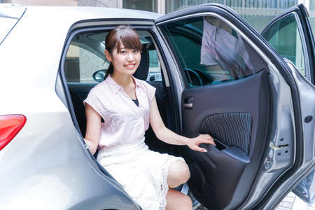 Woman get off carの写真素材