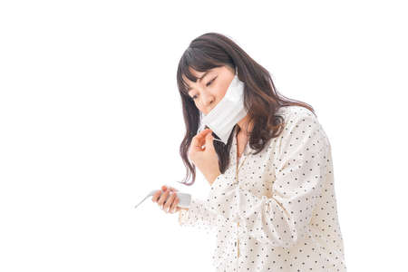 Young woman having a coldの写真素材