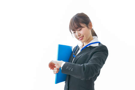 Businesswoman checking timeの写真素材