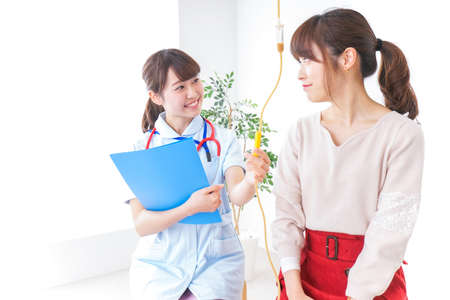 Woman receiving medical treatmentの写真素材