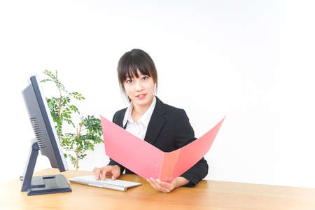 Businesswoman doing a deskwork at officeの写真素材