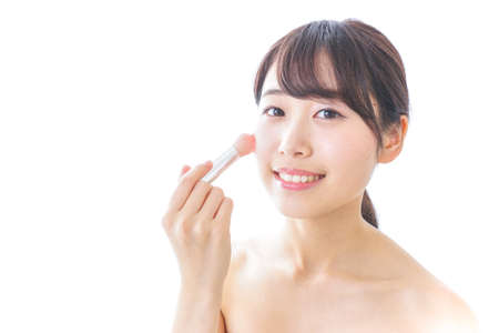 woman making herself upの写真素材