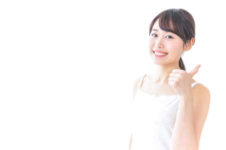 beauty woman giving someone ok signの写真素材