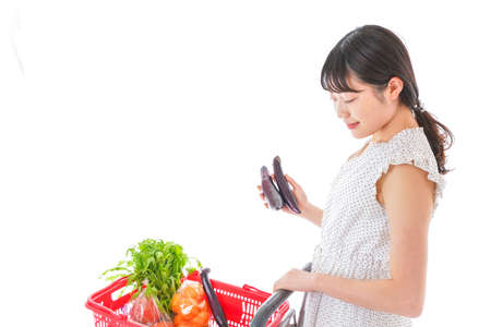 Young woman shopping at supermarketの写真素材