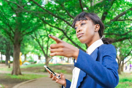 african woman pointing to somethingの写真素材