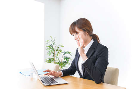 Businesswoman working in officeの写真素材