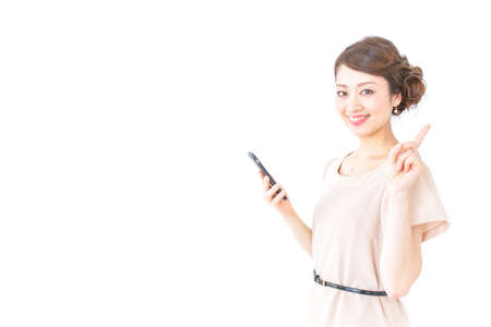 woman in dress pointing to somethingの写真素材