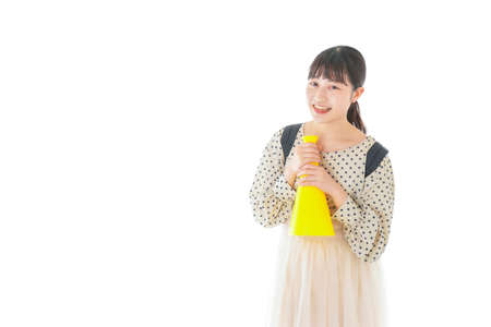 Young woman cheering sports gameの写真素材