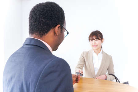 Businesswoman paying by credit cardの写真素材
