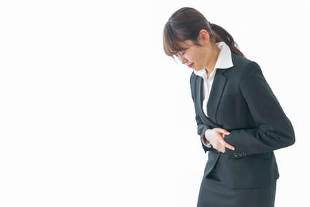 businesswoman suffering from stomachacheの写真素材