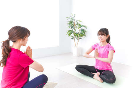 Young woman at Yoga classの写真素材