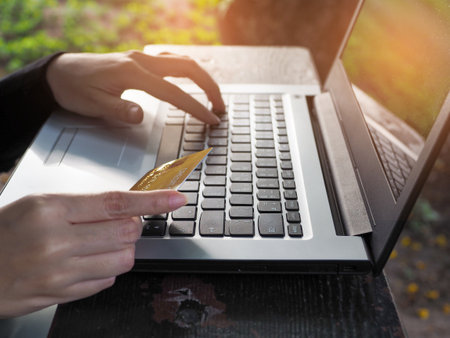 Businesswoman using credit card Paying for products via laptop online shopping .Convenience in spendingの写真素材