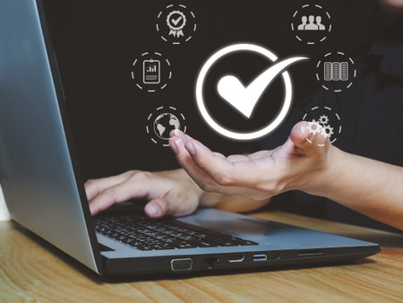 Quality Management with QA Assurance , QC Quality Control Standards and certification concepts Man's hand showing the standard of a product or serviceの写真素材