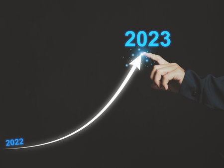 Arrow from 2022 to 2023. Businessman drawing line arrows from 2022 to 2023. Business startup. New concept. New style of operation in the coming year.の写真素材