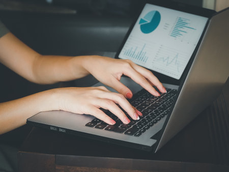 young woman analyzing business marketing strategy checking account earnings teleconferenceの写真素材