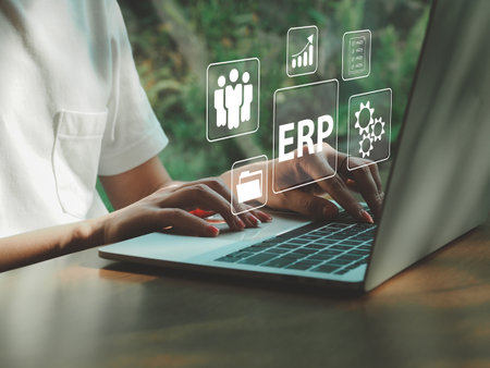 Businesswoman using computer to work with ERP management software for document storage HR Management finance and marketingの写真素材