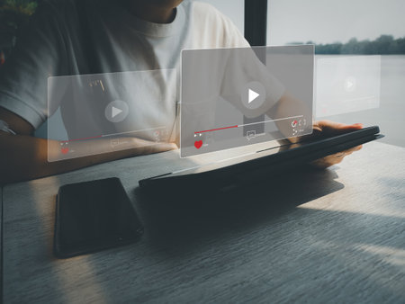 Young women choosing to watch live streaming via digital technologyの写真素材