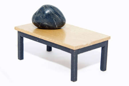 Stone is on the edge of the tableの写真素材