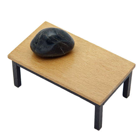 Stone is on the edge of the tableの写真素材