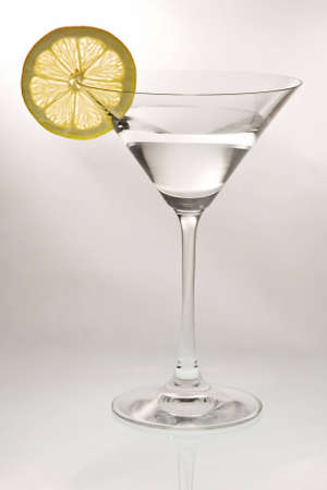 Cocktail glass with a lemon slice の写真素材