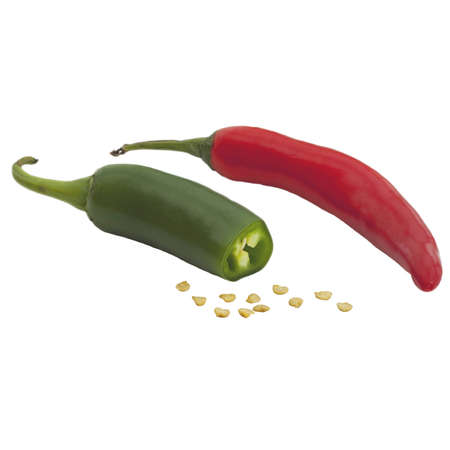 A green chile sliced and a whole red chile and seedsの写真素材