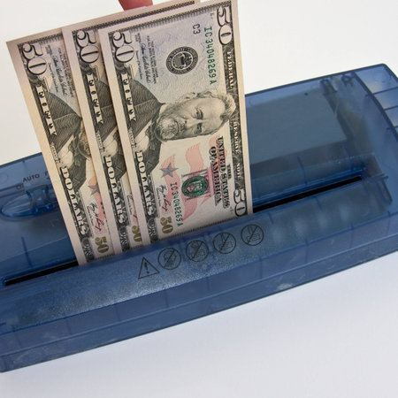 Put the money into the shredder