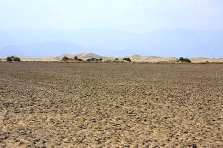 Dunes in the background of a desert landscapeの写真素材