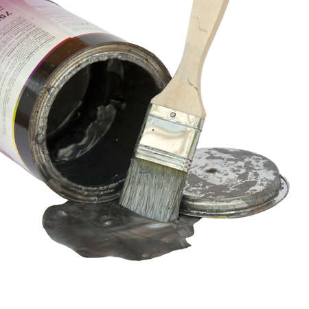 Brush with paint, a color pot and a lid over whiteの写真素材