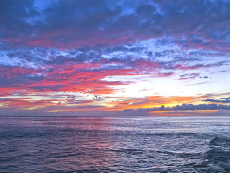 Shining sky at the sea during sunsetの写真素材