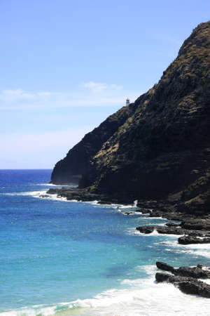 Lighthouse at the steep coast of Hawaiiの写真素材