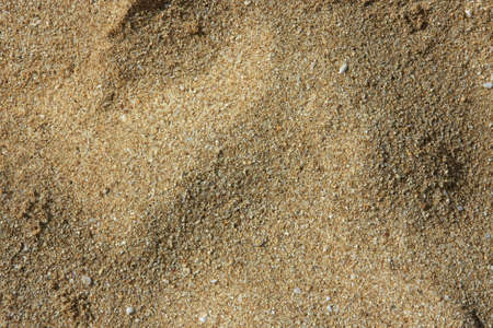 Background of a close-up of sand and small pebblesの写真素材