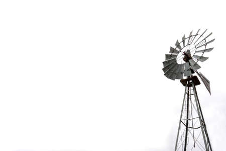 Wind mill for water pumping over white with copy spaceの写真素材