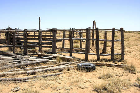 Tire and wood dumped in the desertの写真素材