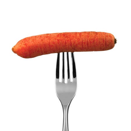 A carrot on a fork over white backgroundの写真素材