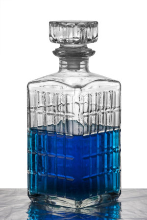 A crystal carafe filled with blue liquidの写真素材