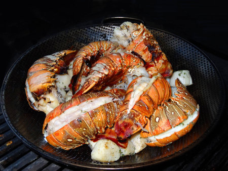 Lobsters in a bowl on the grillの写真素材